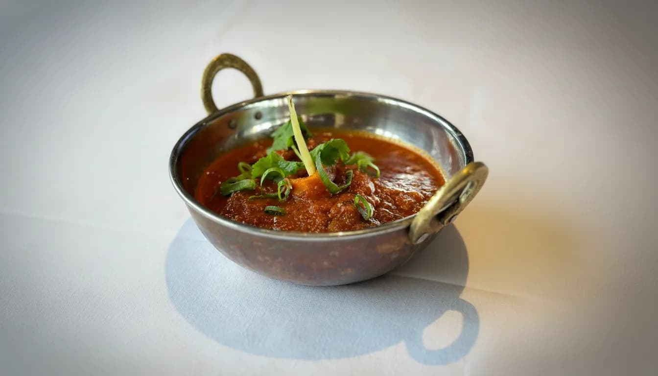 Slow-cooked goat curry finished with coriander and chilli oil.